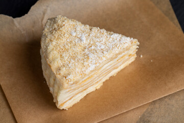 multi-layered cake made of buttercream and thin wheat cakes