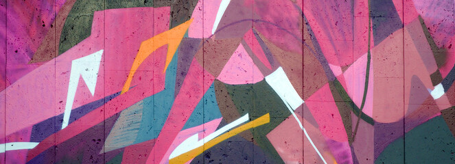 Colorful background of graffiti painting artwork with bright aerosol outlines on wall. Old school...