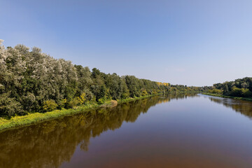 Obraz premium the flow of the river in the warm season in sunny weather