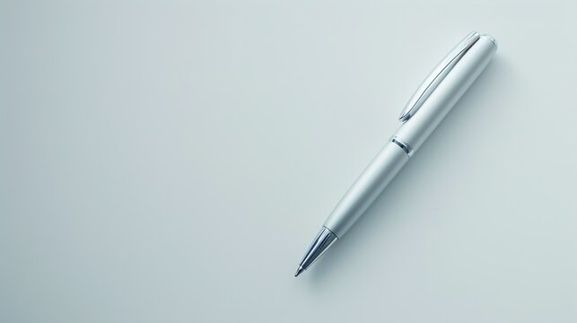 A UHD close-up of a sleek silver pen resting on a pristine white surface, with ample empty space beside it for branding or text, creating a minimalist and professional image.
