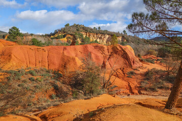 View of a small gorge with red earth and red hills