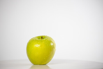 beautiful fresh and radiant green apple, healthy and natural food on white background