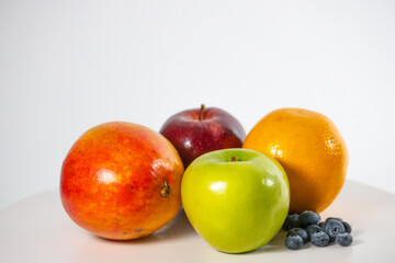 Healthy fresh fruits on white background