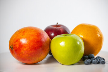 Healthy fresh fruits on white background
