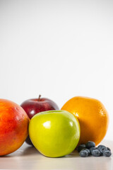 Healthy fresh fruits on white background