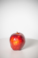 beautiful fresh and radiant red apple, healthy and natural food on white background