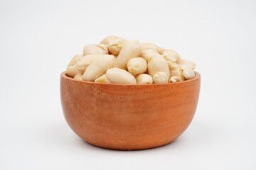Cooked peanuts in a wooden bowl.Isolated Background