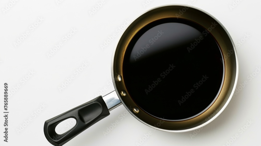 Aufkleber a black frying pan with a black handle on a white surface with a black handle on the bottom of the f