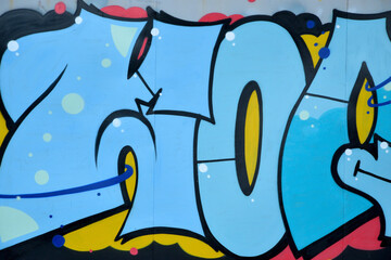 Colorful background of graffiti painting artwork with bright aerosol outlines on wall. Old school...