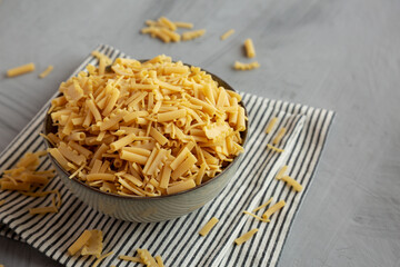 Dry Assorted Italian Pasta in a Bowl, side view. Copy space.