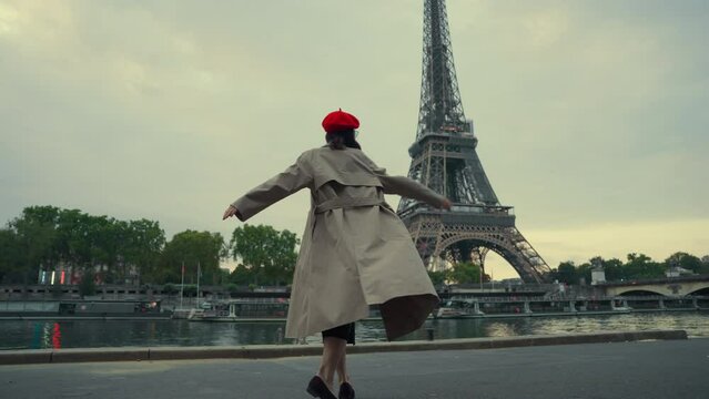 Woman in Trench Coat by the Seine with Eiffel Tower