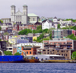Panoramic view of St John's Harbour with a ship at dock and the city's downtown in the background