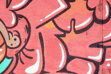 Colorful background of graffiti painting artwork with bright aerosol outlines on wall. Old school...