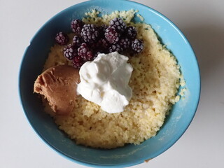 sweet porrifge with fruit and cream
