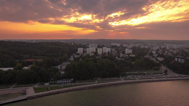 Golden sunset on sea with wiew on city Sopot