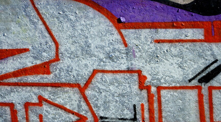 Colorful background of graffiti painting artwork with bright aerosol outlines on wall. Old school...