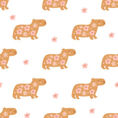 Cute floral Capybara seamless pattern. Summer repeat background with cute animal, pink flowers. Vector childish wallpaper, textile design, print, gift paper, wrapping, fabric.