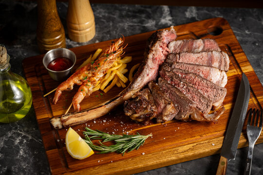 surf and turf, tomahawk steak and shrimps