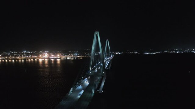 Aerial Panning Shot Of Arthur Ravenel Jr Bridge Against Clear Sky, Drone Flying Over Cooper River At Night - Charleston, South Carolina
