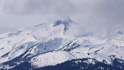 Black tusk mountain covered in clouds during spring in Canada 2
