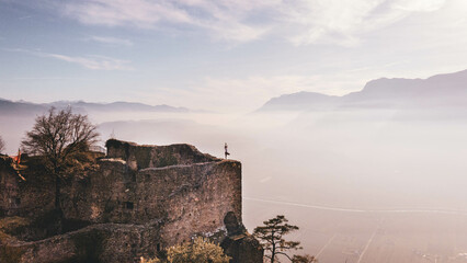 Balancing at the Edge: Yoga Tree Pose with a Castle Backdrop, Offering an Epic View of the Vibrant...