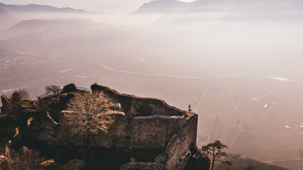 Yoga Tree Pose on Castle Wall, Offering an Epic View of the Vibrant Valley