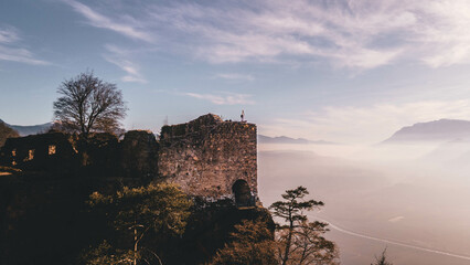 Yoga Tree Pose on Castle Wall, Offering an Epic View of the Vibrant Valley