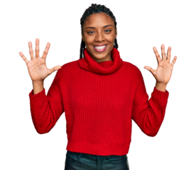 African american woman wearing casual winter sweater showing and pointing up with fingers number ten while smiling confident and happy.