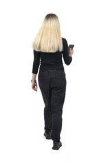 back view of a woman walking looking at the smartphone on white background