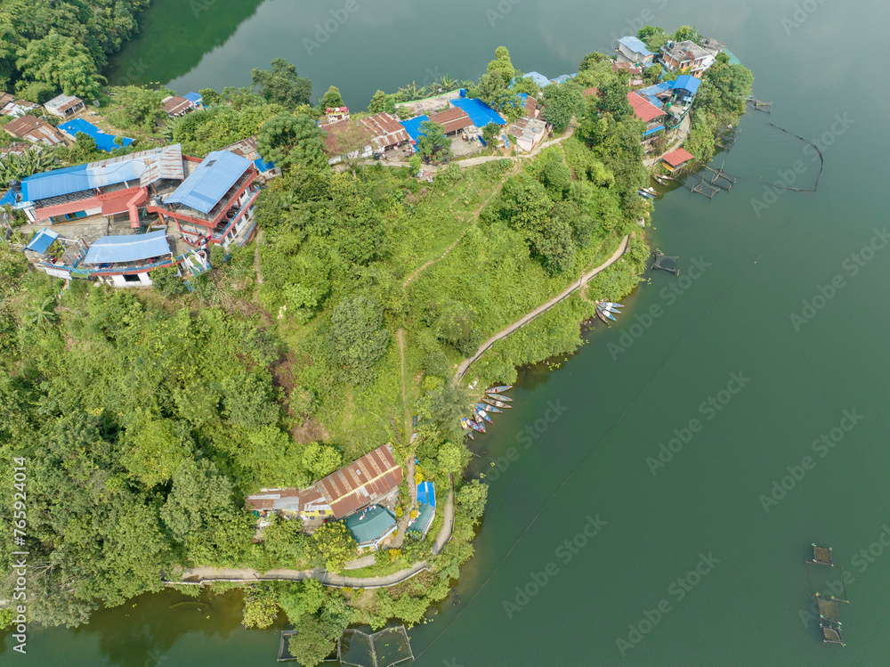 Canvas Prints Aerial view of Begnas Lake the third largest lake of Nepal. Wild nature and trees with houses surround the lake, typical Nepalese boats can be seen in the water