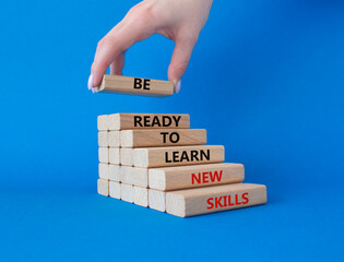 Learn new skills symbol. Concept words Be ready to Learn new skills on wooden blocks. Beautiful...