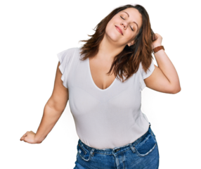 Young plus size woman wearing casual white t shirt stretching back, tired and relaxed, sleepy and yawning for early morning