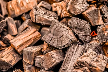 Deurstickers Stacked firewood texture © kossovskiy