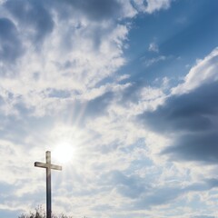 White stone cross against a background of blue sky with clouds.
Concept: religious theme of faith in God and signs, memorable dates, materials for church events