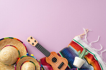 Cinco de Mayo arrangement. Overhead snapshot of representative items: hats, a vihuela, cactus in...