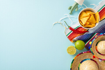 Top-down view showcasing Cinco de Mayo essentials: hats, potted cactus, vibrant serape, lime, spicy...