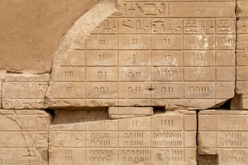 Hieroglyph Numbers Carved on a Stone Wall in Karnak Temple Complex, Luxor, Egypt - 765934635