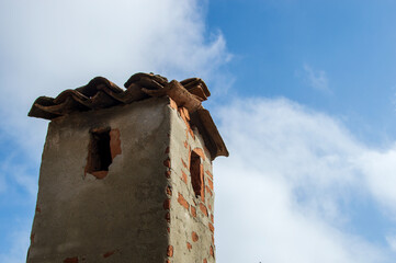 chimney pipe made of brick on the roof of the house
