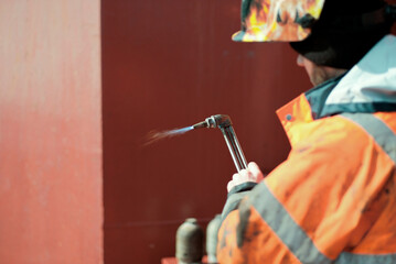 Hot Work Permit Risk Assessment. Certified Welder Man Holding Oxygen Acetylene Cutting Torch