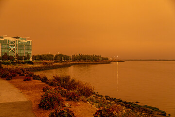 California Westpoint Slough on San Francisco Bay, California; Orange Smoke Filled Skies from Nearby Out of Control Wildfires Caused by Drought and Climate Change - 765935654