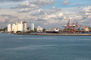 The Industrial Ocean Shipping Port and Harbor of Colombo, Sri Lanka, With Containers, Ships, Vessels and Cranes  - 765937042