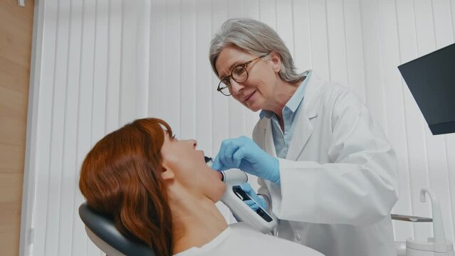 Dental Examination: Dentist Taking X-Ray of Woman's Teeth