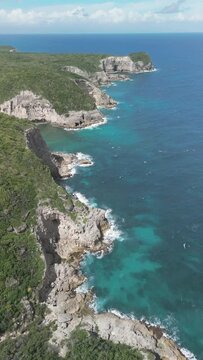 Aerial video over cliffs on the Bamari Galante coastline