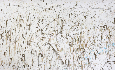 Textured white wall with brown stains. Looks like modern art painting. Background plastered surface. Graphic background backdrop
