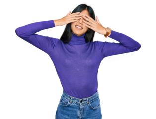 Beautiful young asian woman wearing casual clothes covering eyes with hands smiling cheerful and funny. blind concept.