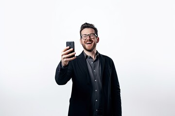 Man laughing and taking a selfie with his smartphone