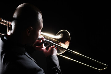 Trombone player. Trombonist playing brass instrument - 765960497