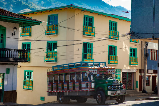 Colorful traditional rural bus from Colombia called chiva at the central square of the small town of Pacora in Colombia