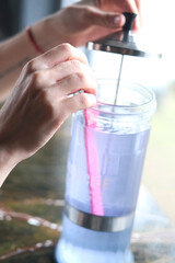 Barber disinfects scissors and comb