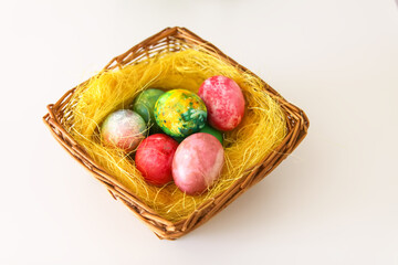 Colorful Easter eggs. Traditional Easter food and decoration in the basket.